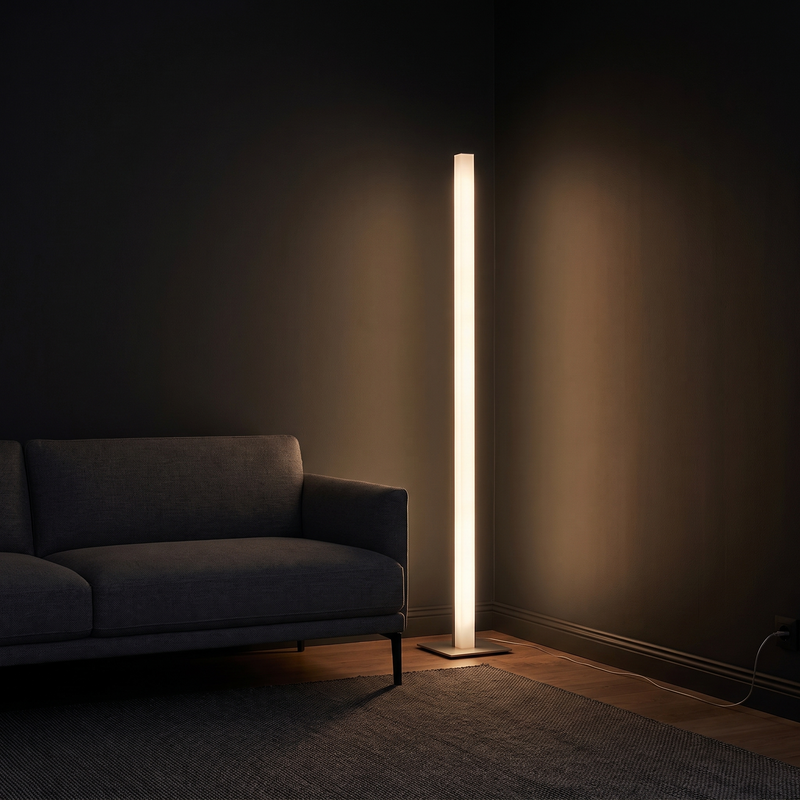 Minimalist LED Corner Floor Lamp glowing warm white beside a sofa