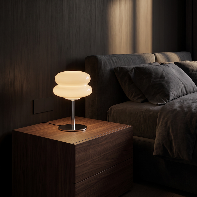 Modern Glass Mushroom Table Lamp on a walnut bedside table in a dark bedroom
