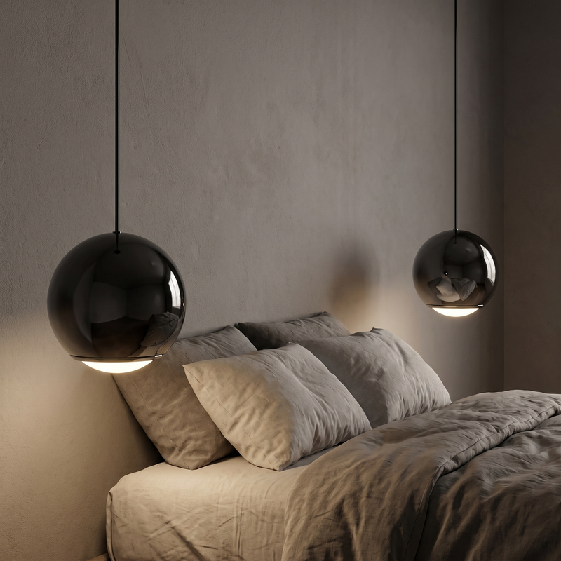 Black Mirror Globe Pendant Light beside a bed