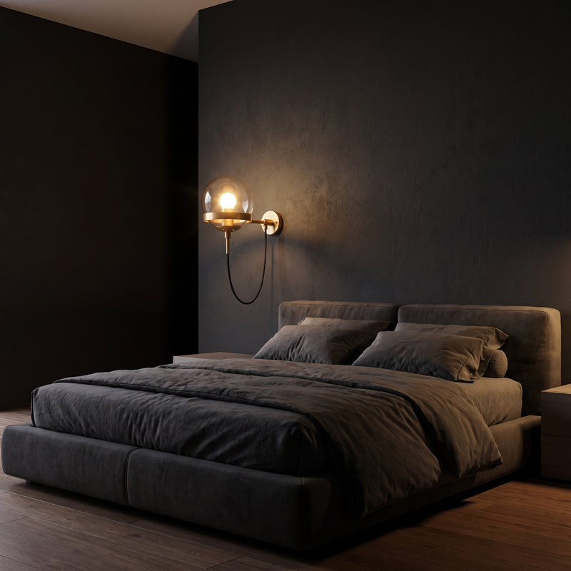 Looped Cord Glass Globe Sconce in a dark modern bedroom