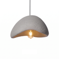 Wabi sabi stone-look pendant light on white background