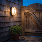 Outdoor wall light - Retro Caged Bulkhead Outdoor Wall Light on an exterior wall at dusk