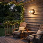 Outdoor wall light - Retro Caged Bulkhead Outdoor Wall Light on a garden wall at night