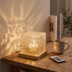 Ocean wave projector lamp - Crystal Cube Ocean Wave Lamp on a desk beside a mug for scale