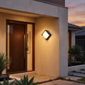 Outdoor wall light - Diamond Outdoor Wall Light beside a front door at dusk