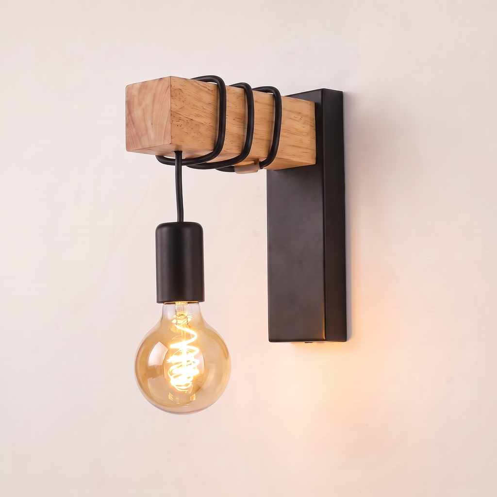 Modern Industrial Wall Sconce in black on a plain background