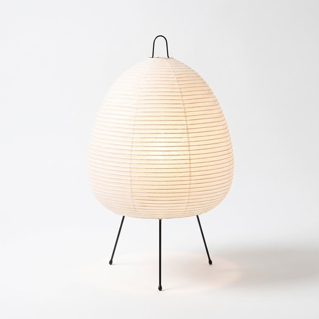 Table Lamp with Tall Rice Paper Egg Shade on Black Tripod Legs on white background