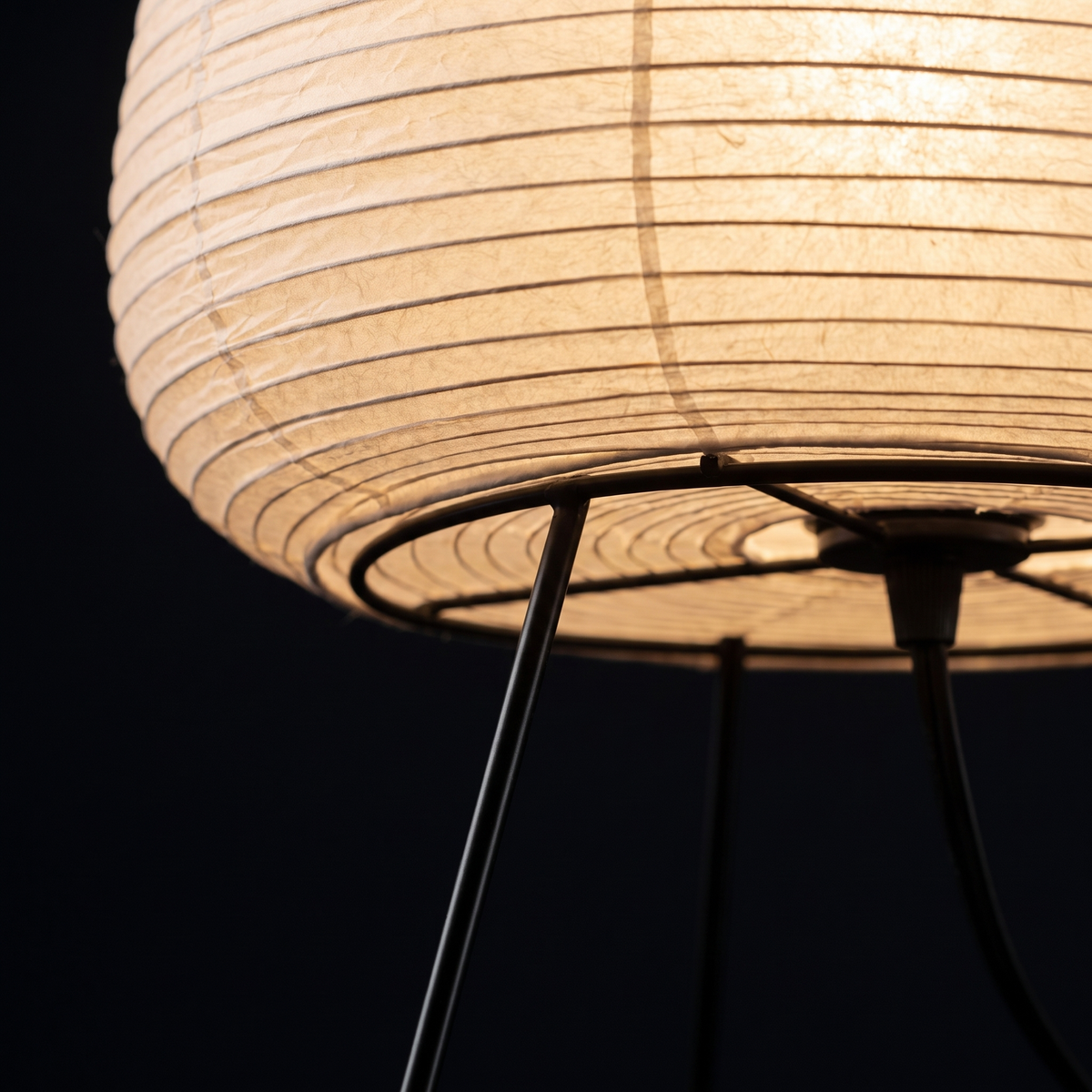 Table Lamp with Tall Rice Paper Egg Shade on Black Tripod Legs lifestyle 4