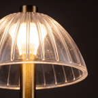 Close-up of the clear ribbed dome shade of the cordless table lamp