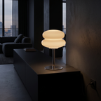 Modern Glass Mushroom Table Lamp on a black console in a dark modern living room