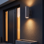 Cylinder Up & Down Outdoor Wall Light mounted beside a front door on a dark rendered exterior wall at dusk