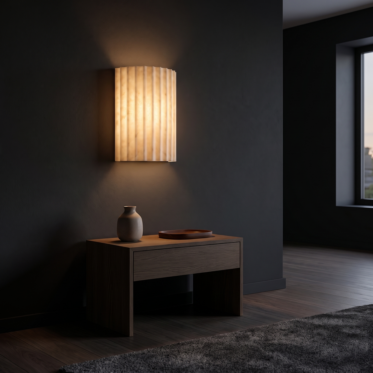 Fluted Resin Wall Sconce shown to scale on the wall above a bedside table