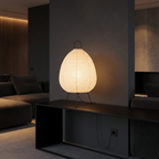 Rice Paper Lantern Tripod Table Lamp on a black console in a dark modern living room