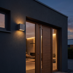 Up & Down Outdoor Wall Light mounted beside a front door on a dark rendered exterior wall at dusk