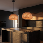 Woven Bamboo Dome Pendant Light hanging in a pair over a dark stone kitchen island