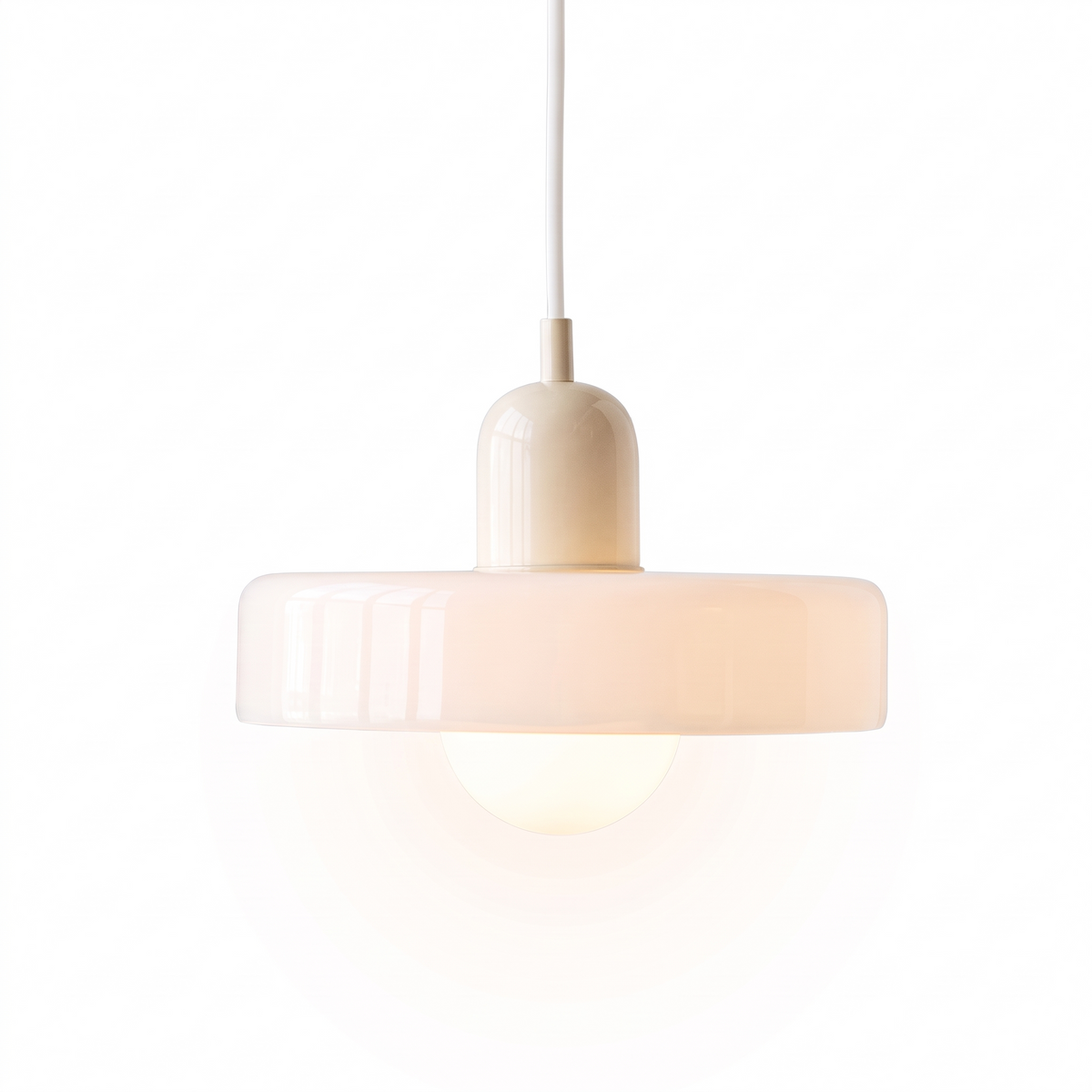 Two-tone colored glass halo pendant light in cream and white on white background