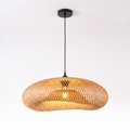 Woven bamboo wave pendant light on white background