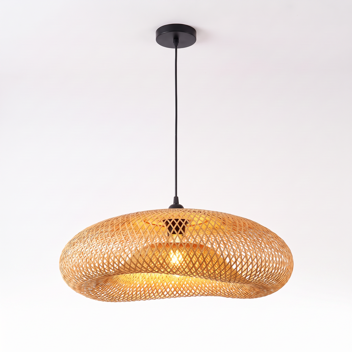 Woven bamboo wave pendant light on white background