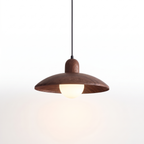 Walnut-finish dome pendant light with opal glass globe on white background