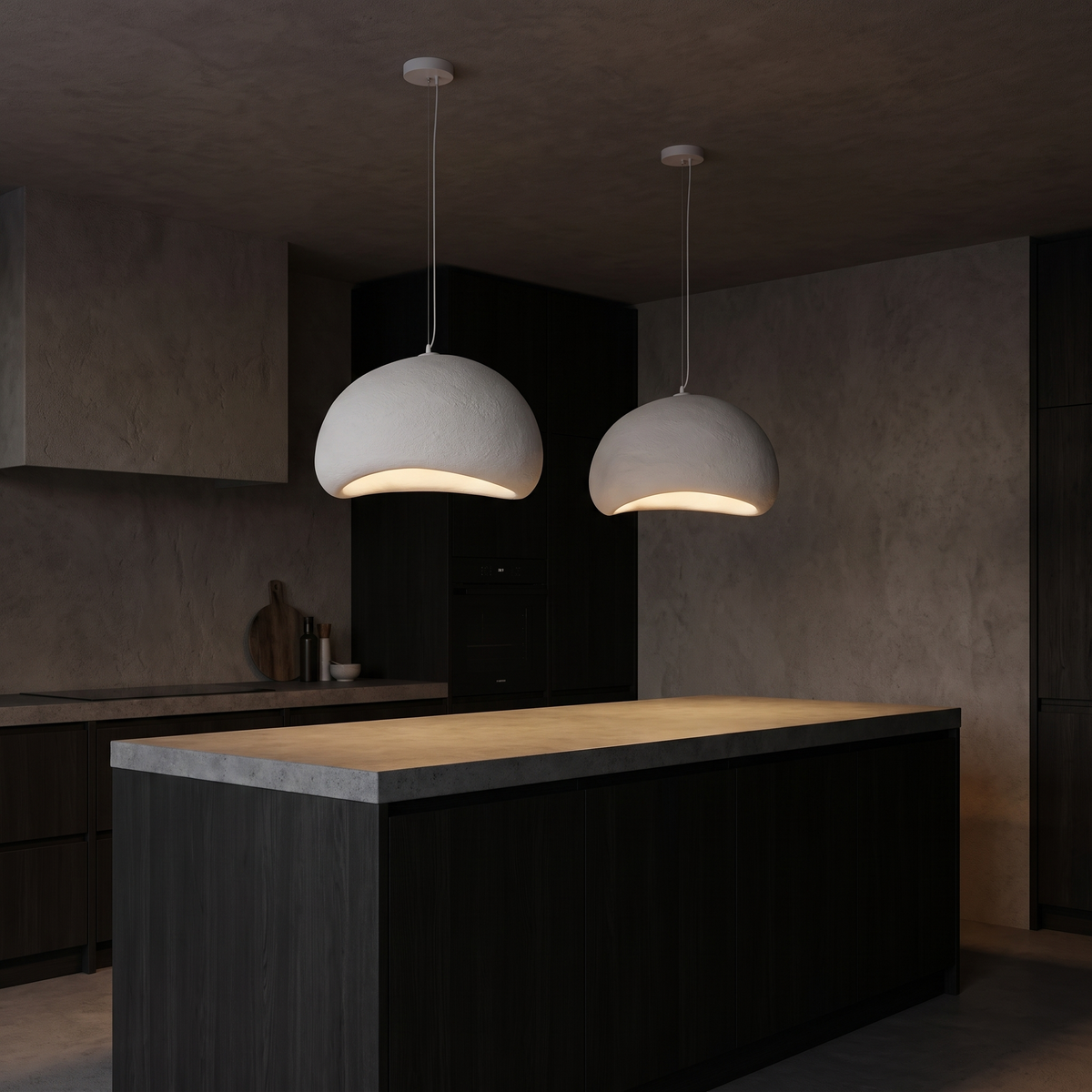 Japandi white cloud pendant lights, a pair hanging over a kitchen island with plaster walls