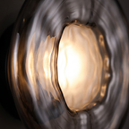 Close-up of the rippled glass disc glowing