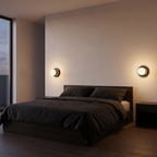 Small globe wall sconces, a pair either side of a bed on a warm white wall