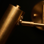 Close-up of the brass cylinder head and folding arm joint