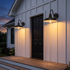 Two Gooseneck Barn Lights beside a farmhouse front door at dusk