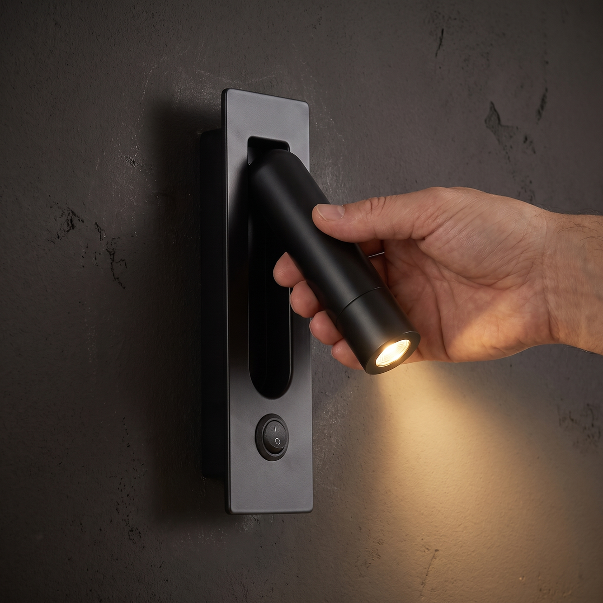Pulling out the arm of the Recessed Bedside Reading Light