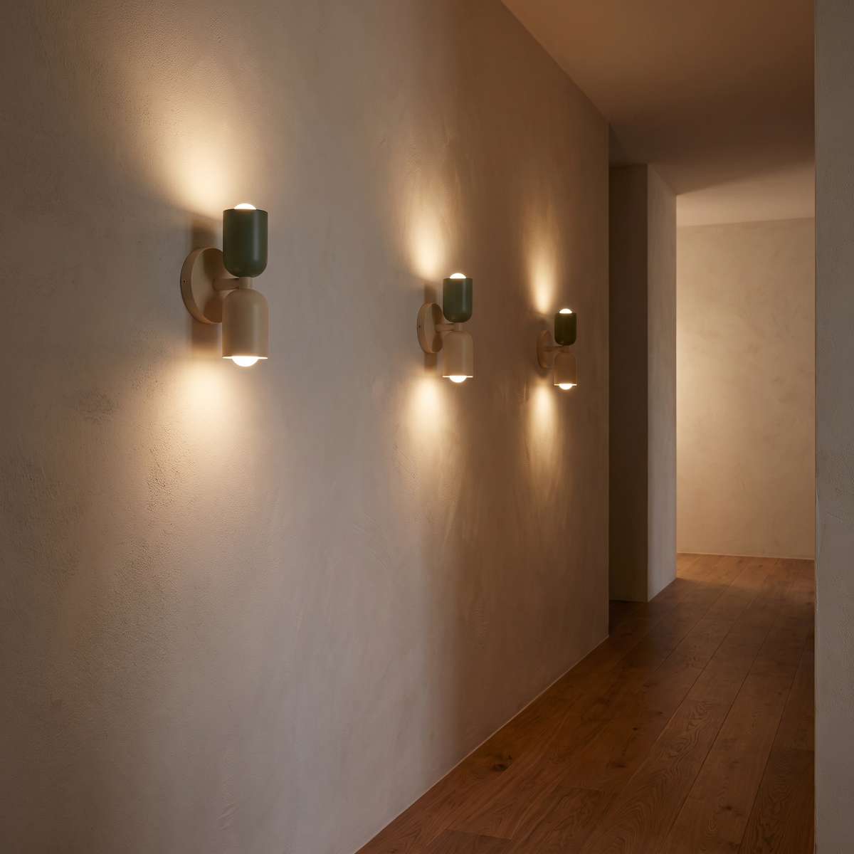 Two-Tone Up Down Wall Sconces lighting a hallway