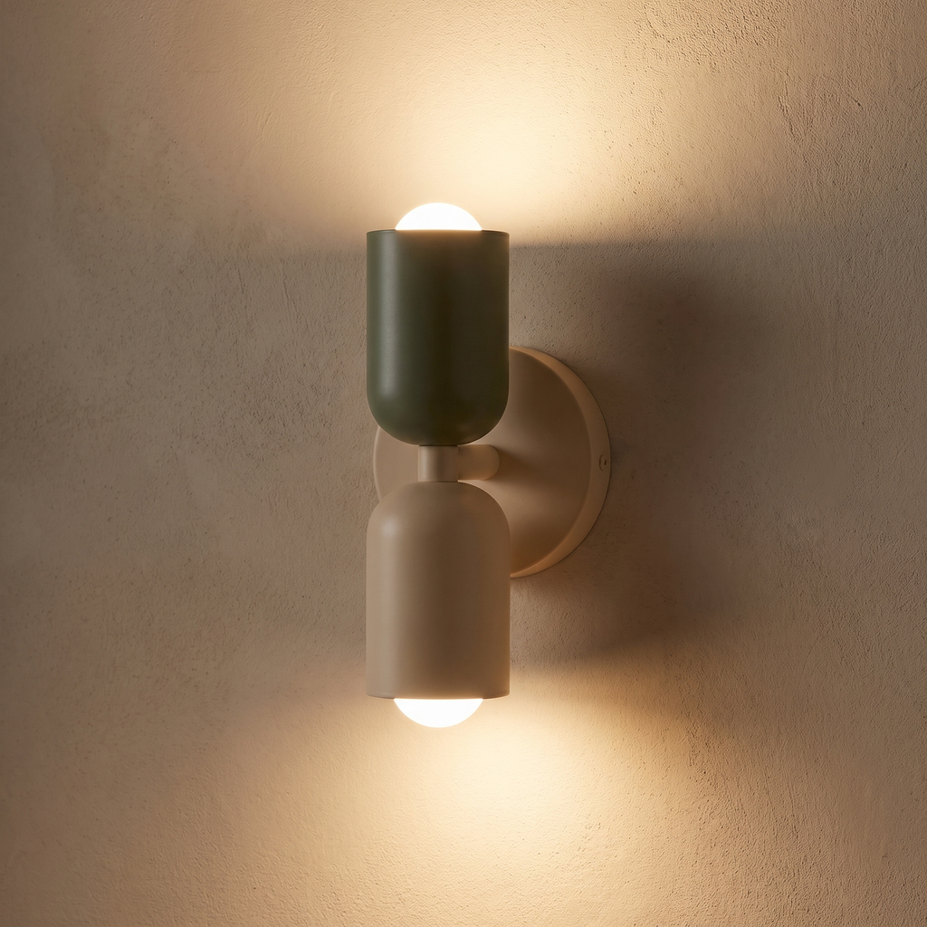 Two-Tone Up Down Wall Sconce casting light up and down a plaster wall