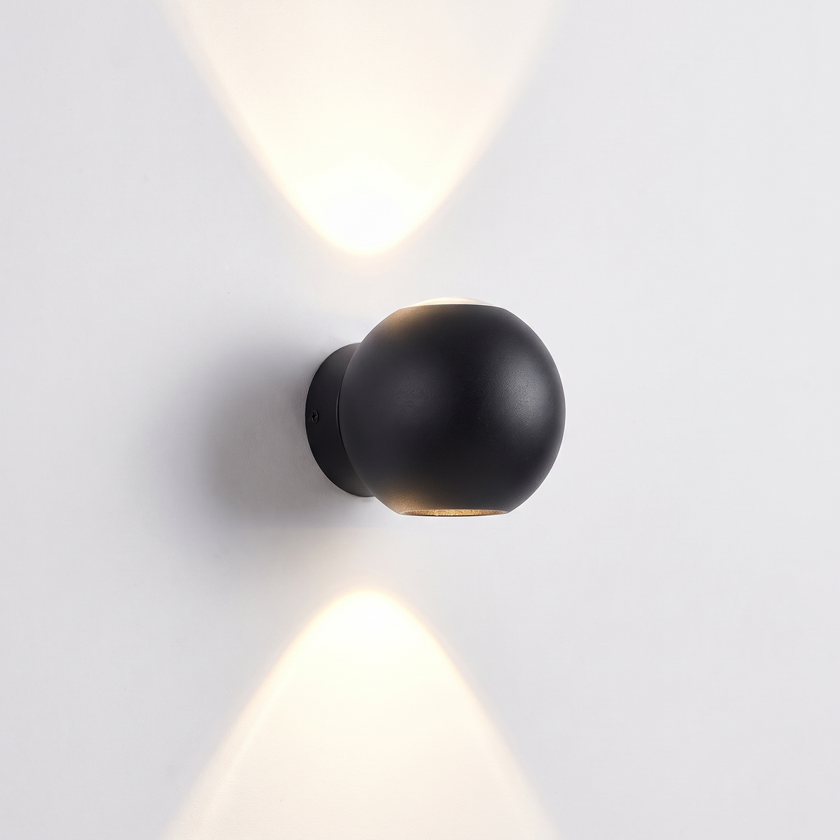 Black Sphere Up Down Wall Light on white background