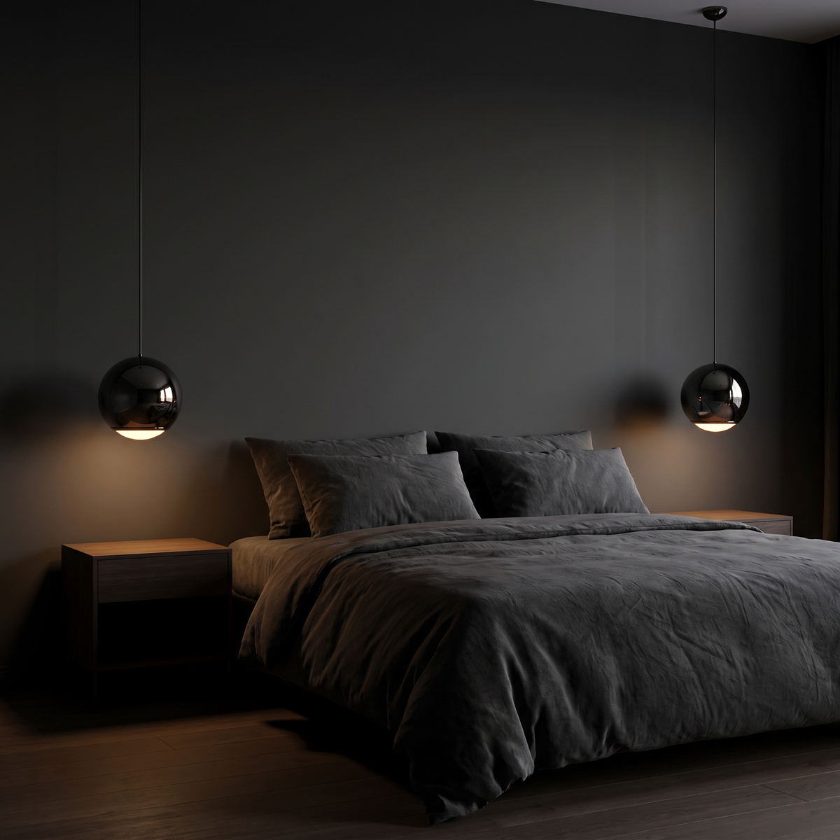 Two Black Mirror Globe Pendant Lights either side of a bed