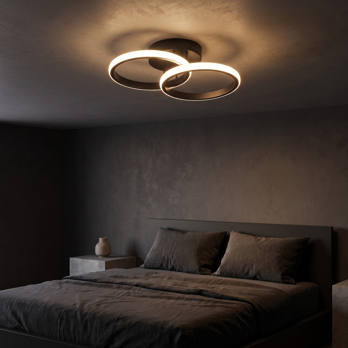 Double Ring LED Ceiling Light above a bed in a dark modern bedroom