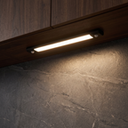 Wireless Under Cabinet Light under a kitchen cabinet over a stone counter