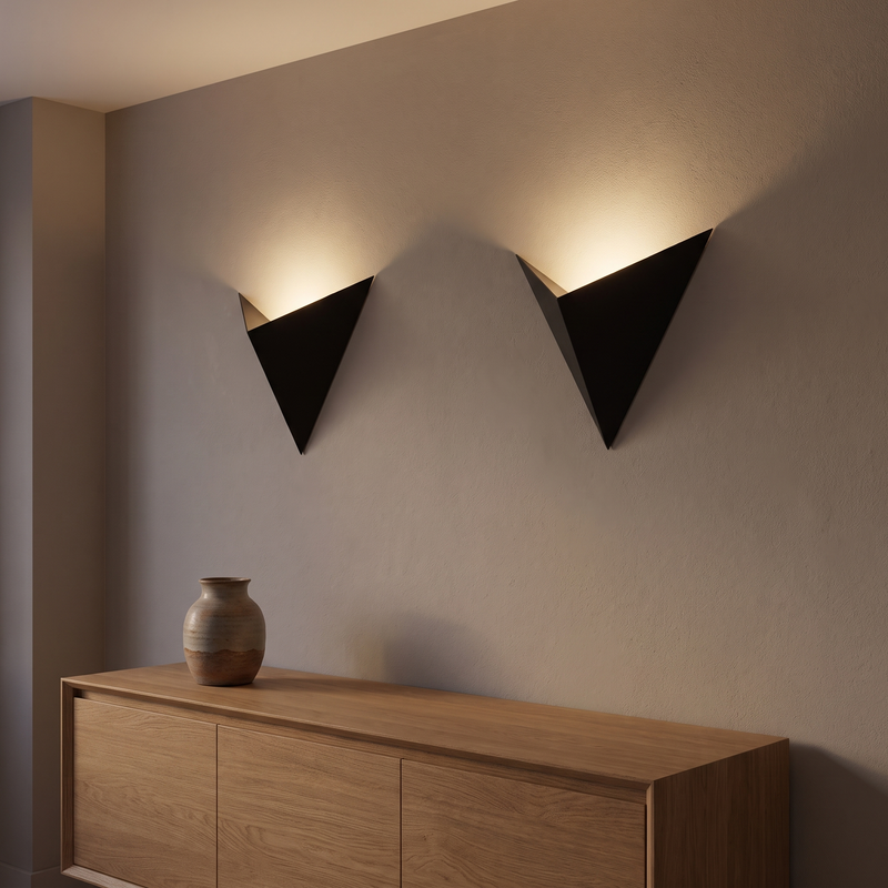 Two black Triangle LED Wall Sconces above a sideboard, shown to scale