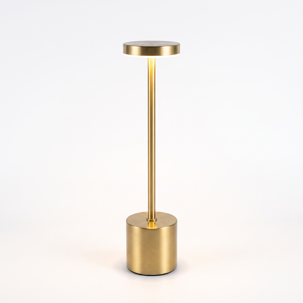 Gold slim cordless table lamp on white background