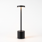 Black slim cordless table lamp on white background