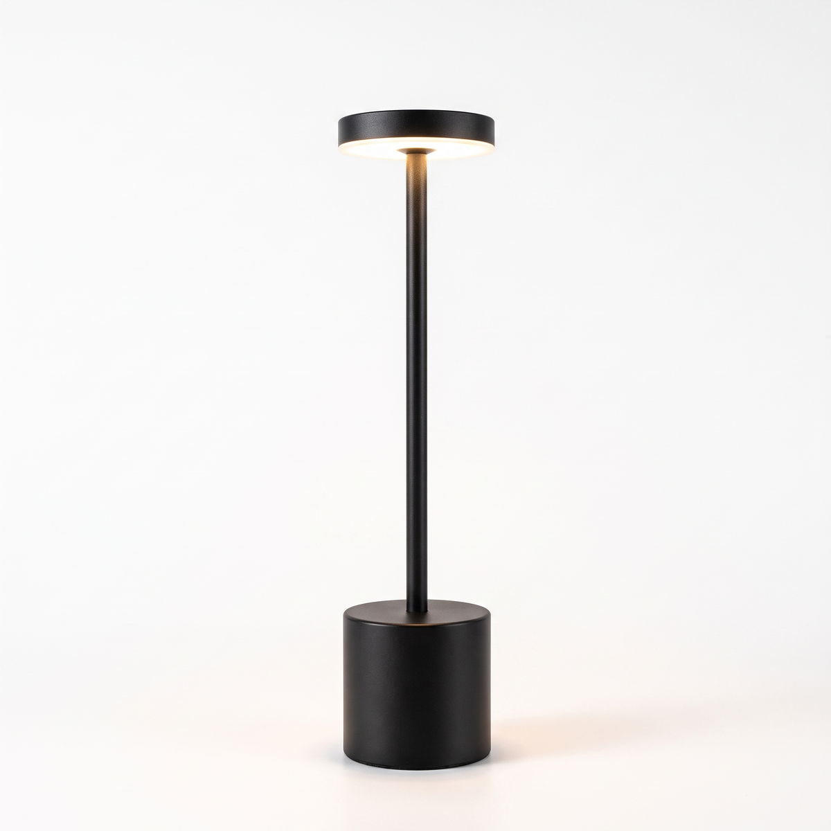 Black slim cordless table lamp on white background