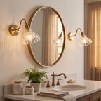Pair of ribbed glass flower wall sconces beside a bathroom mirror