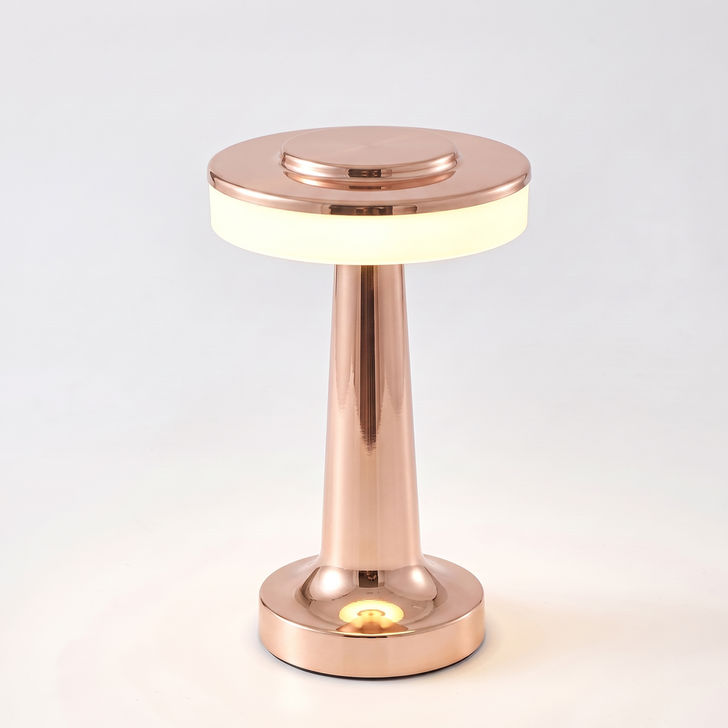 Rose gold cordless mushroom table lamp on white background