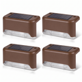 Four brown solar step lights on white background