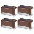 Four brown solar step lights on white background