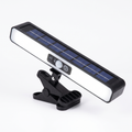 Clip on solar motion light with clamp on white background