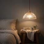 Ribbed glass dome pendant used as a bedside light