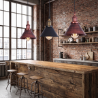 Rust copper and black industrial cone pendants over a bar counter
