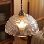 Close-up of ribbed glass dome and brass socket