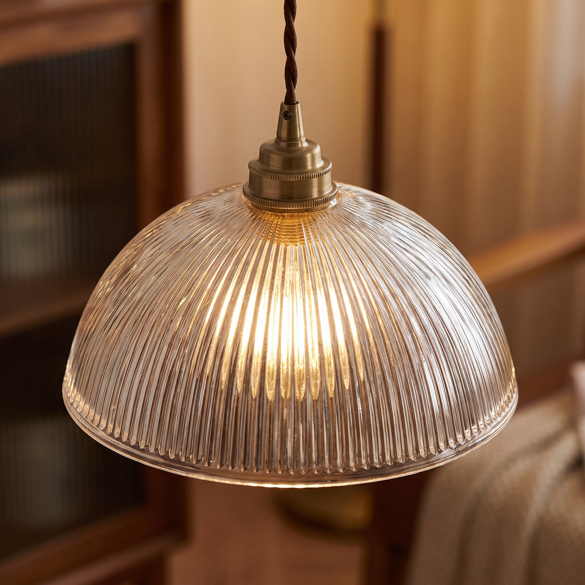 Close-up of ribbed glass dome and brass socket