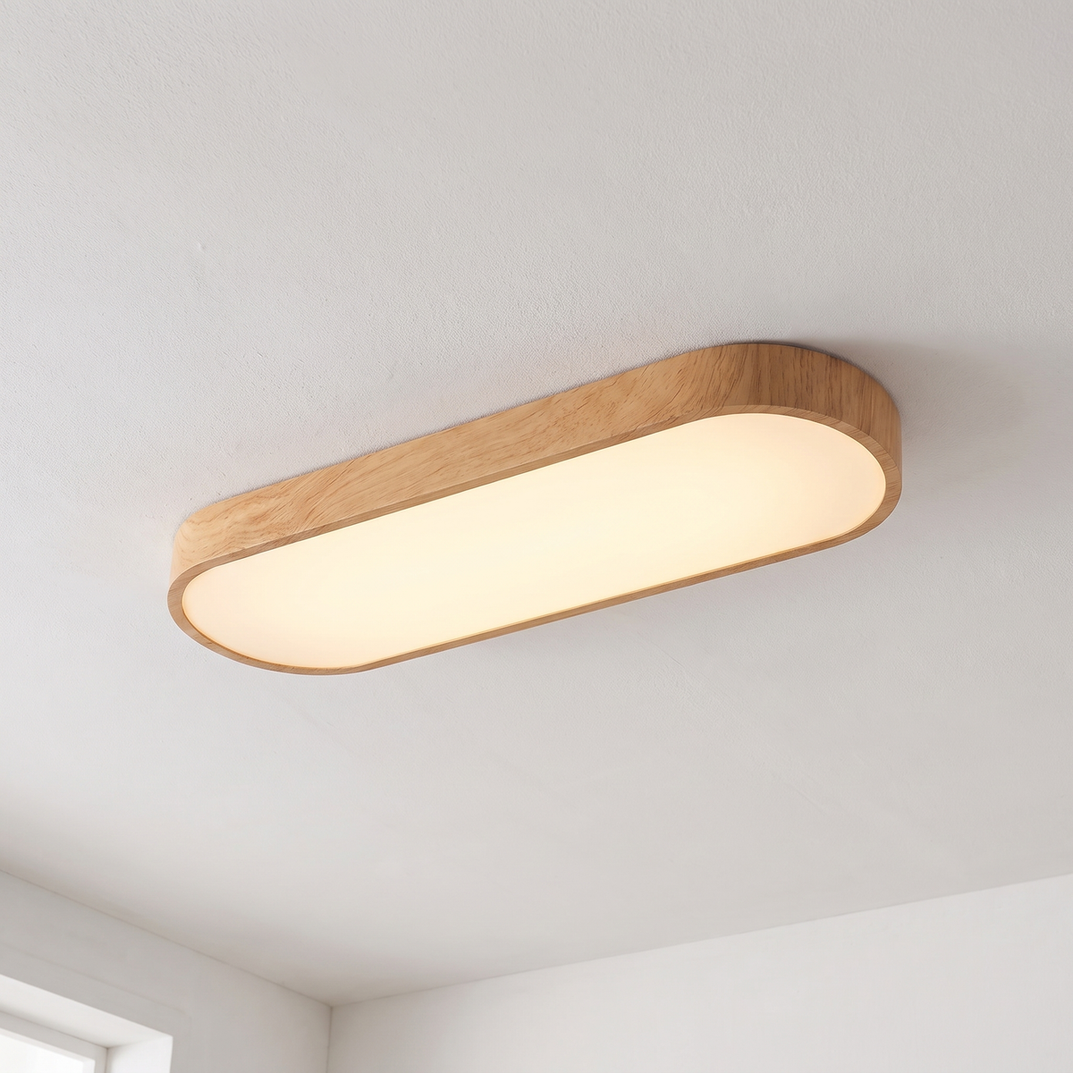 Close-up of oval wood LED ceiling light rim and glow