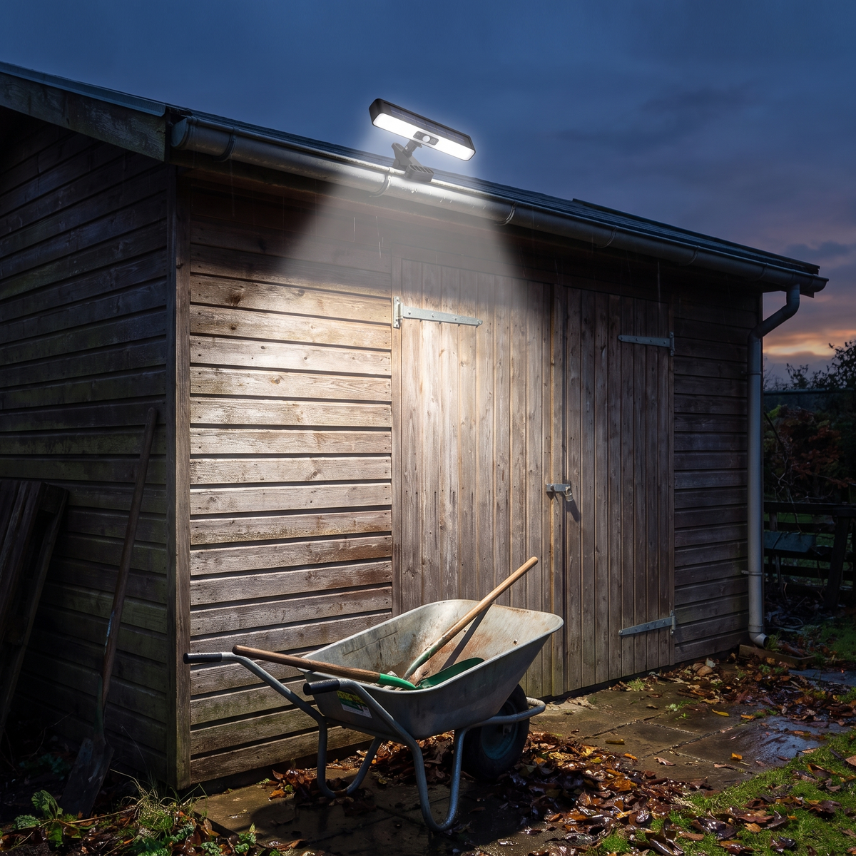 Clip on solar motion light on a shed gutter